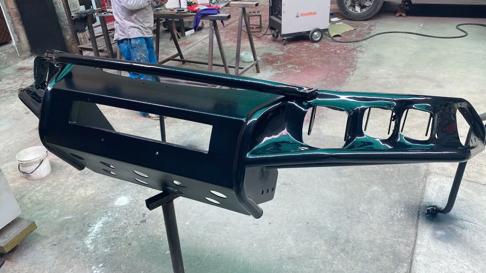 Painted metal bumper in the workshop before installation