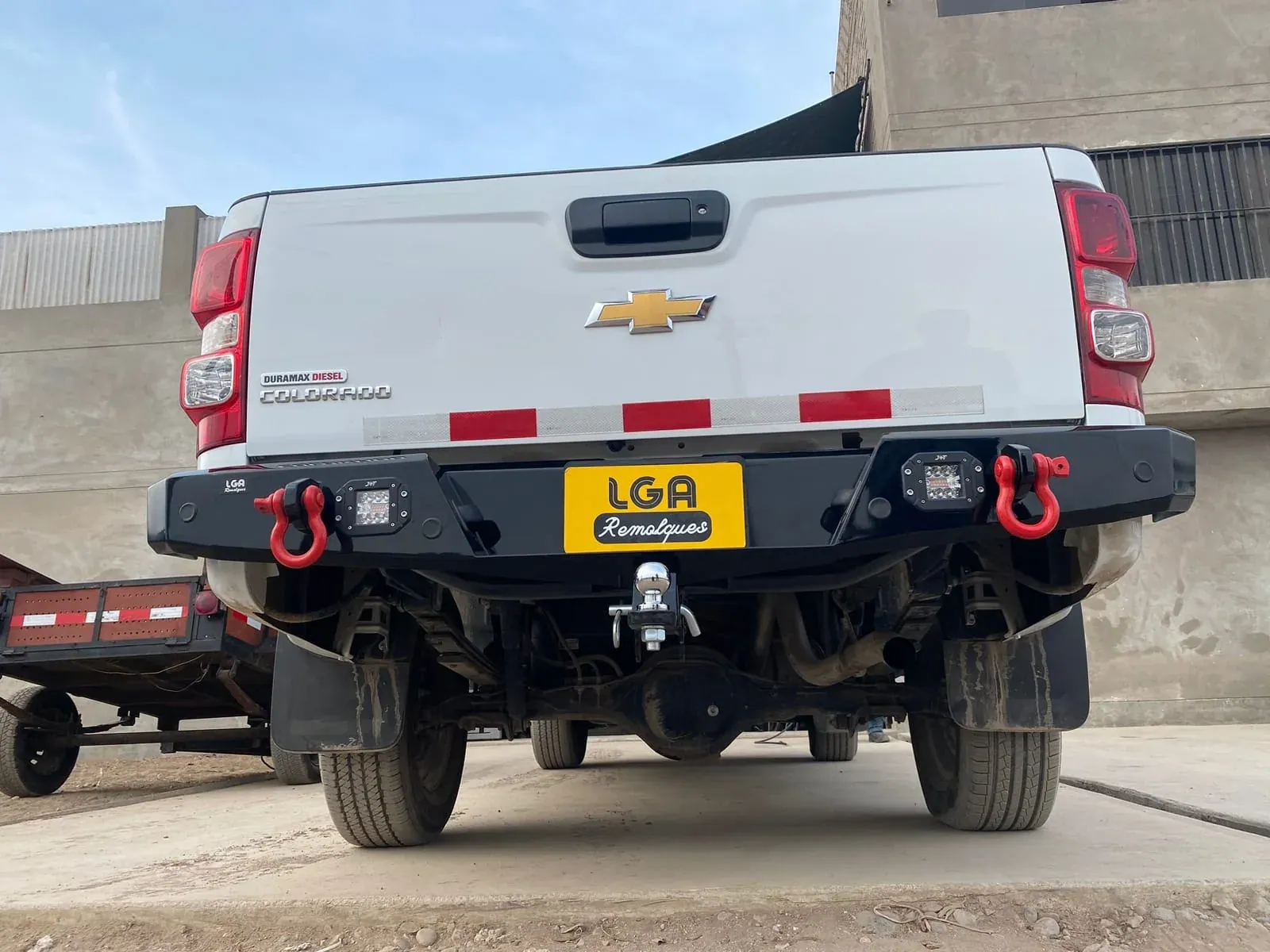 Rear view of a Chevrolet pickup with an installed trailer hitch