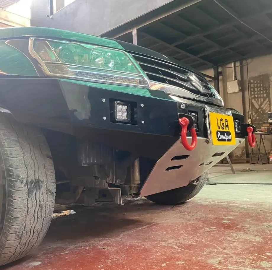 Side view of a Suzuki with a front bumper installed at the workshop