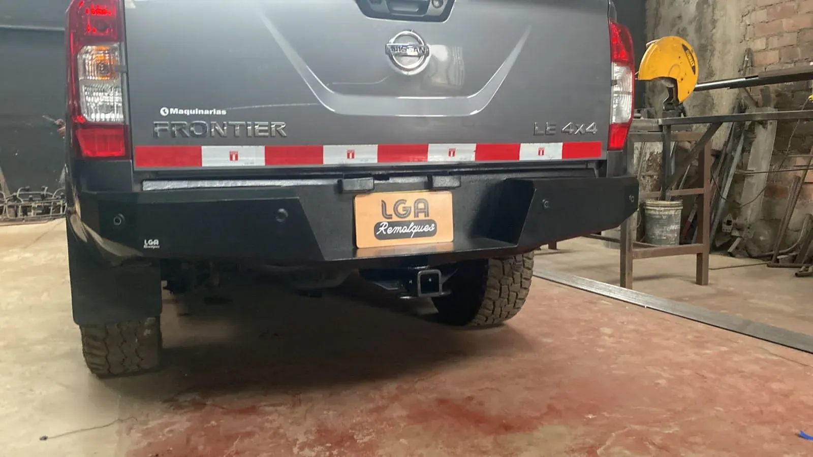 Rear of a Nissan Frontier with a hitch receiver
